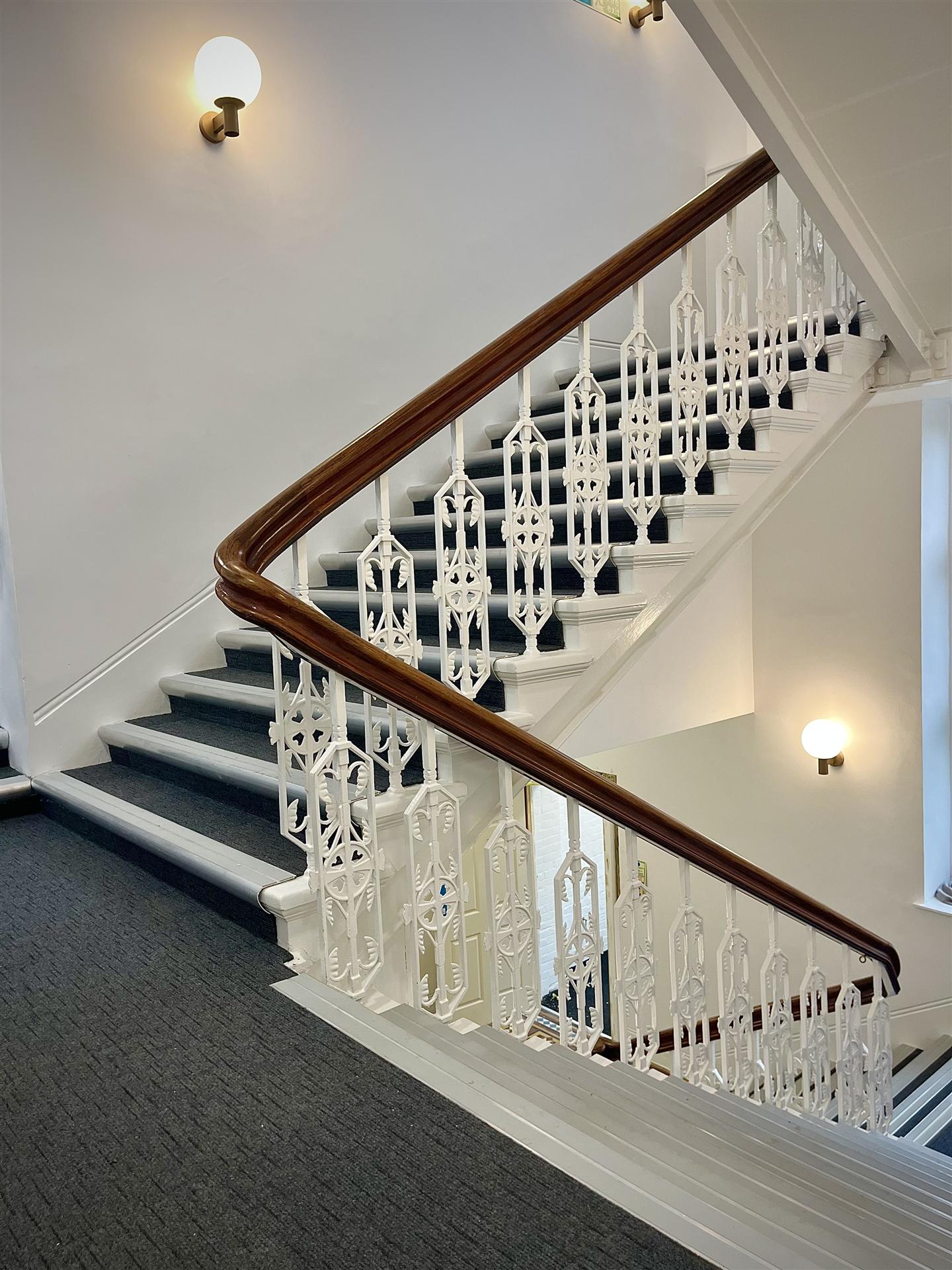 Victorian period staircase with ornate ironwork balustrade, Essex